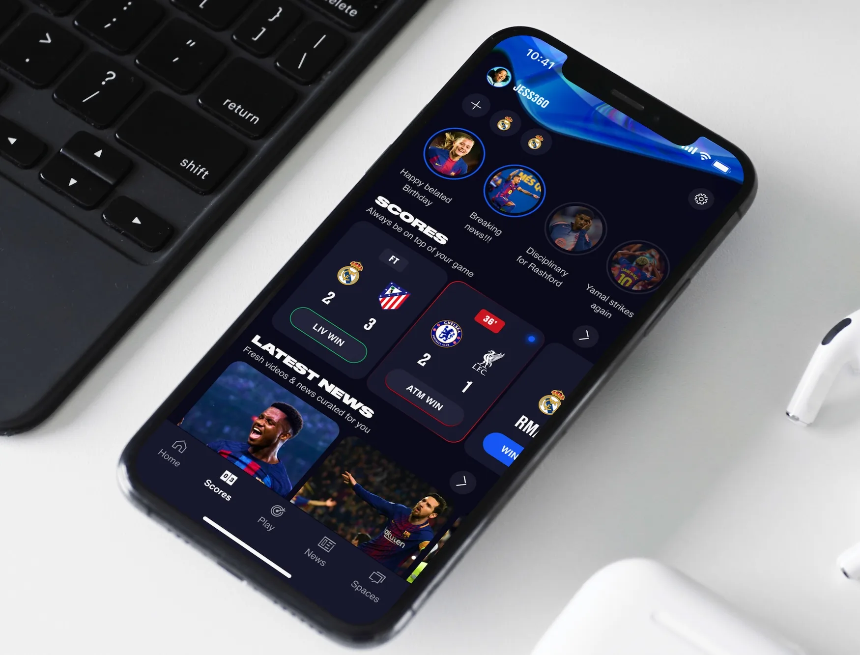 The EA SPORTS App home screen on a phone, showing stories, live scores, and curated news