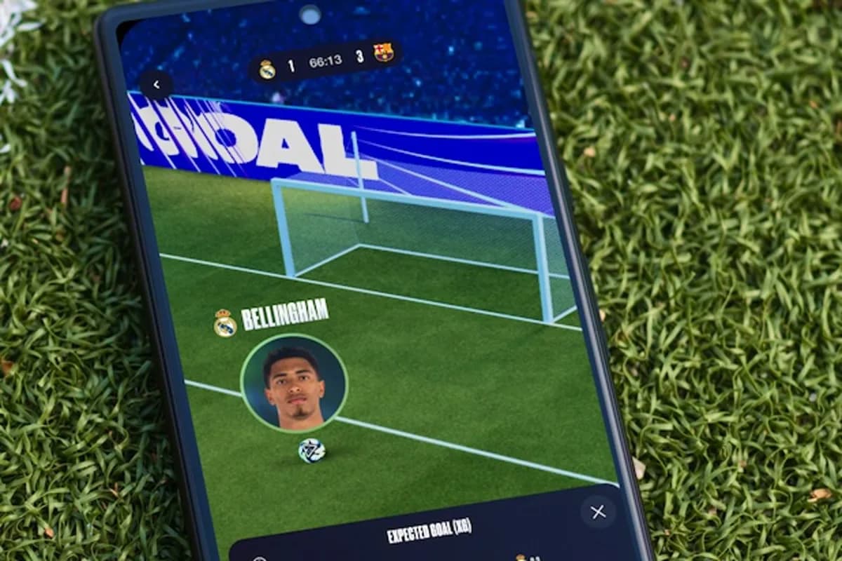 A phone lying on a pitch showing a virtual replay of a Bellingham goal alongside an expected-goals chart