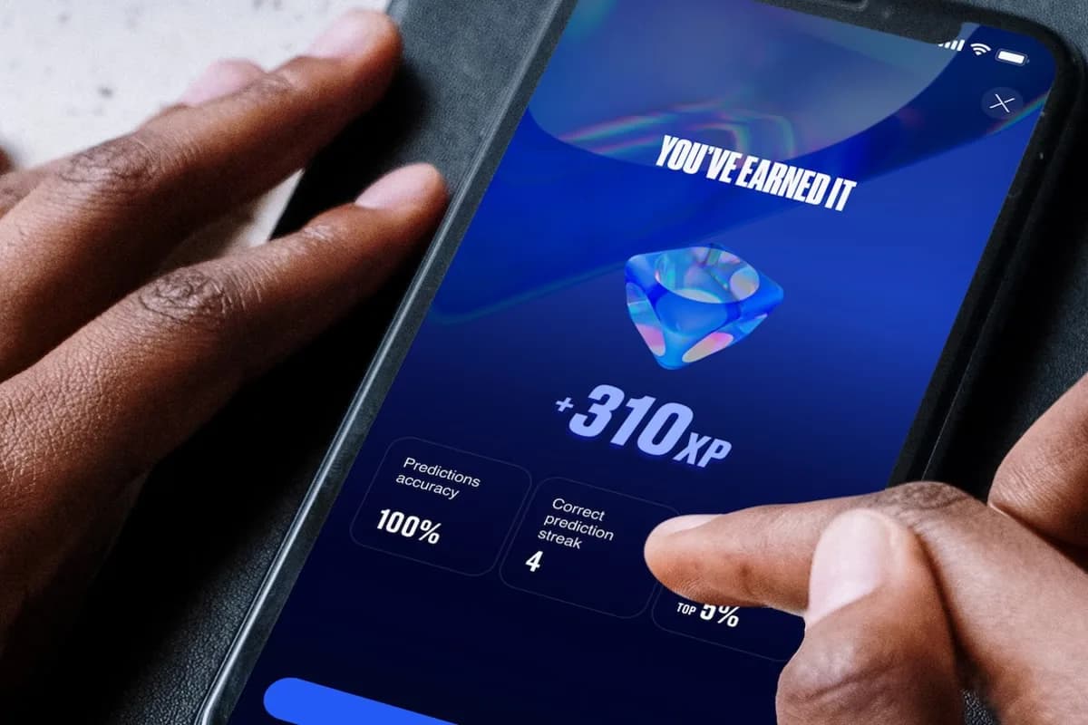 An XP reward screen in the EA SPORTS App awarding 310 XP, showing prediction accuracy and a correct-prediction streak