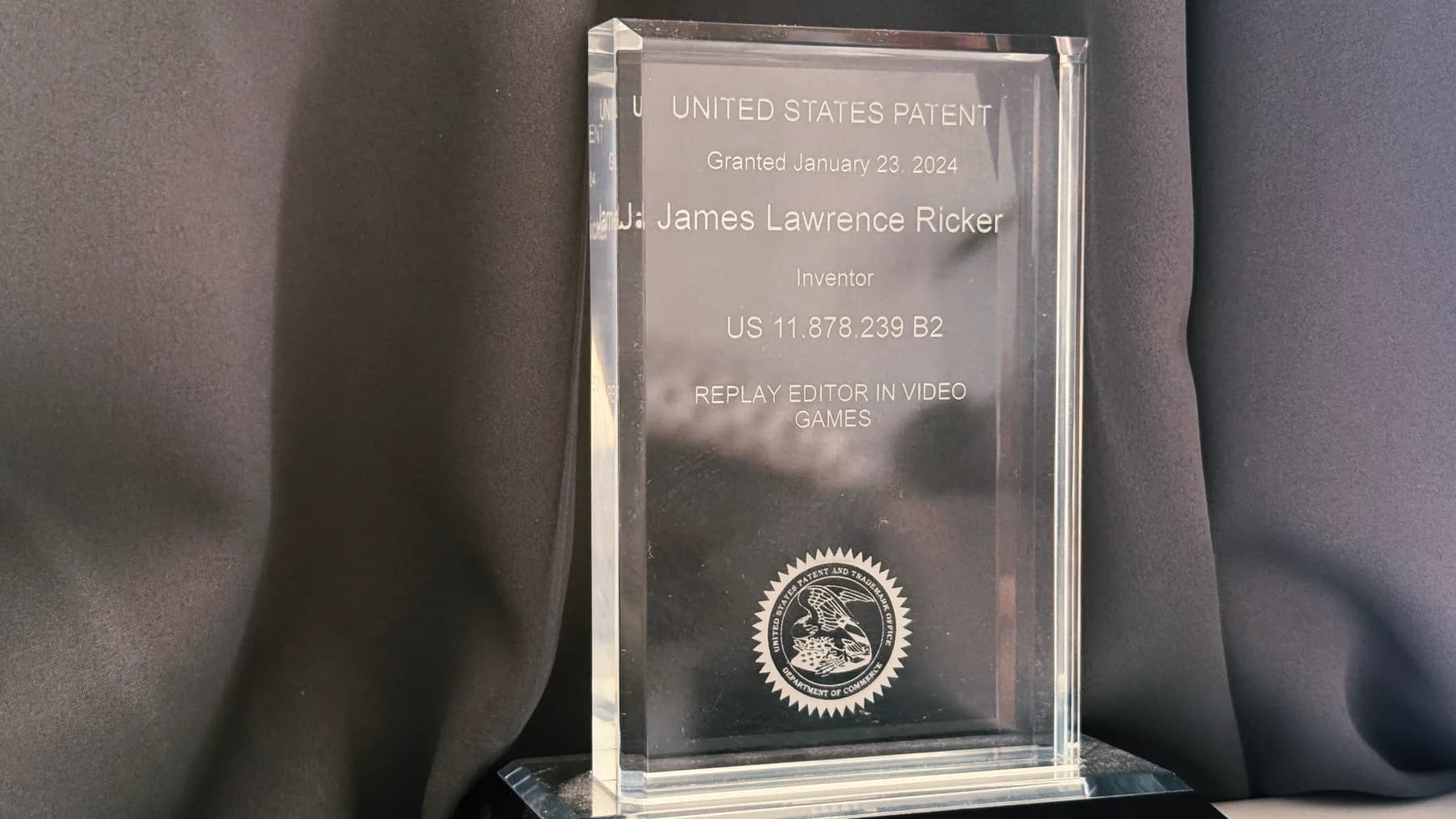 A crystal award engraved with United States Patent US 11,878,239 B2, Replay Editor in Video Games, granted January 23, 2024 to inventor James Lawrence Ricker