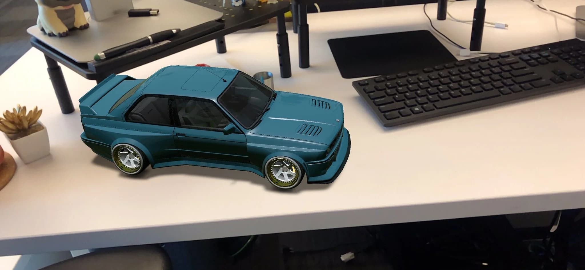 A customized car placed on a real desk using the app's AR viewer