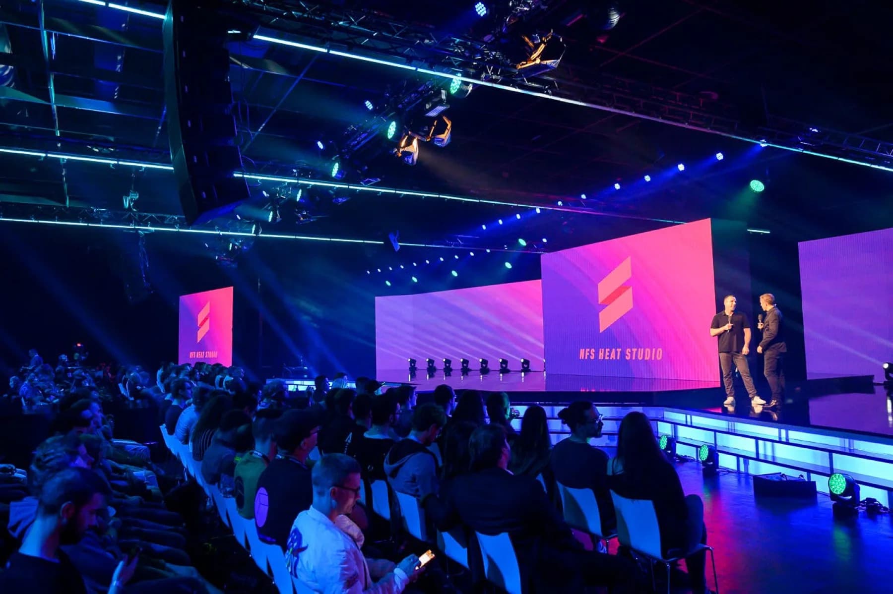 NFS Heat Studio announced on stage at Gamescom 2019's Opening Night Live, with the pink NFS Heat Studio logo on the big screen